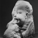 Head and wings of an angel and forehead of another
